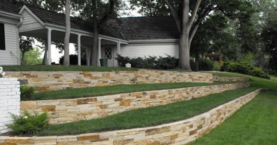 house exterior with stone landscaping